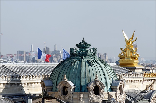 Paris via https://pixabay.com/en/paris-roofs-fireplaces-tourism-2083469/