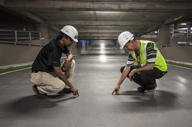 Two men inspecting work