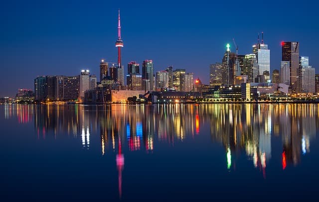 Toronto via https://pixabay.com/photos/buildings-cn-tower-canada-colorful-2297210/